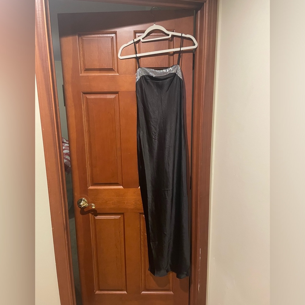 Beautiful black gown with diamond top! Size XS- never worn tags are still on it!